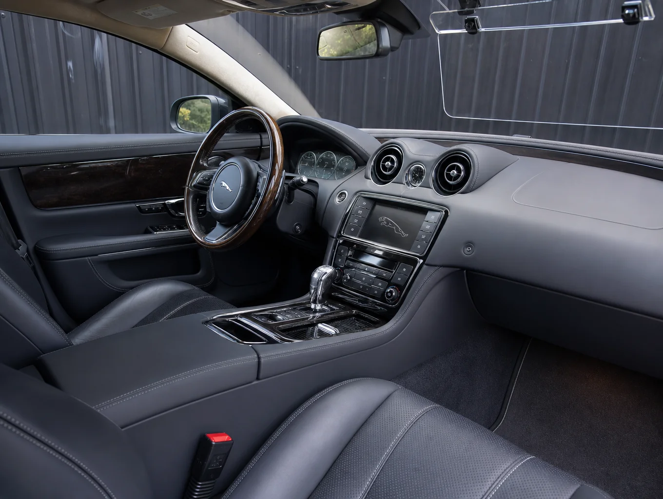Detailed interior cleaning of a luxury car cabin